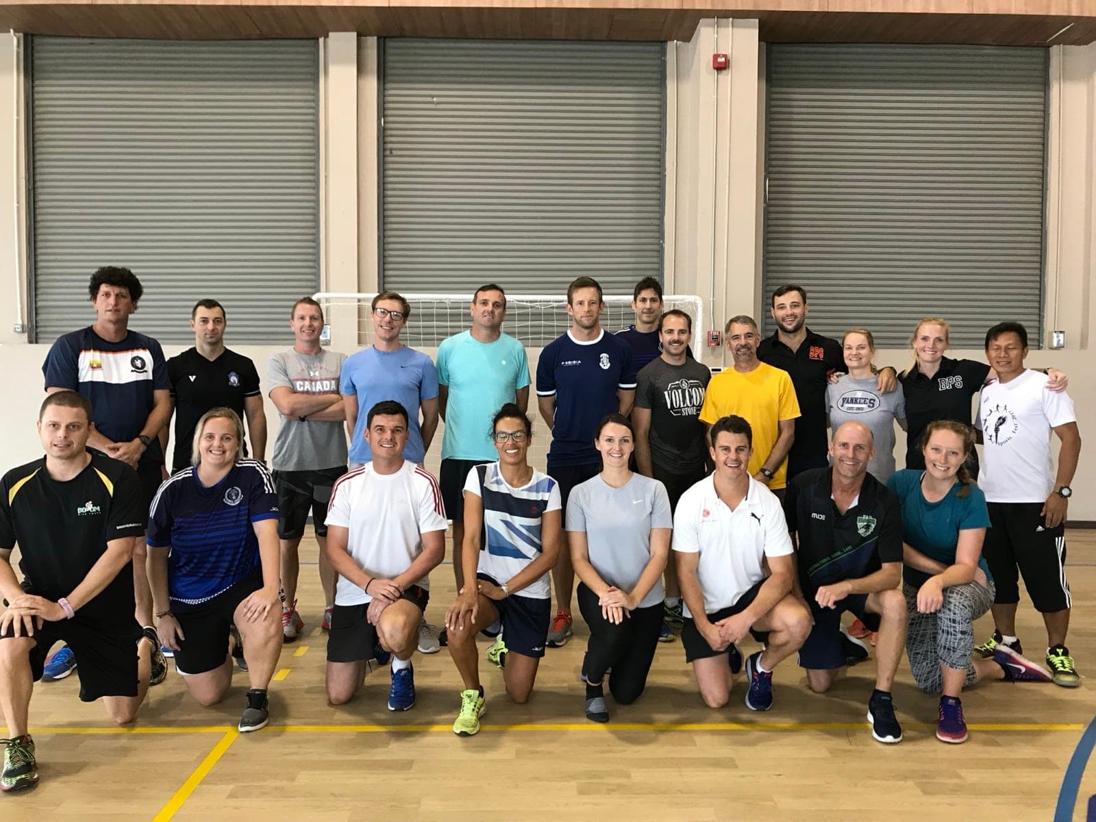Educators gathered in a school gym after a School of Play staff workshop in Bangkok