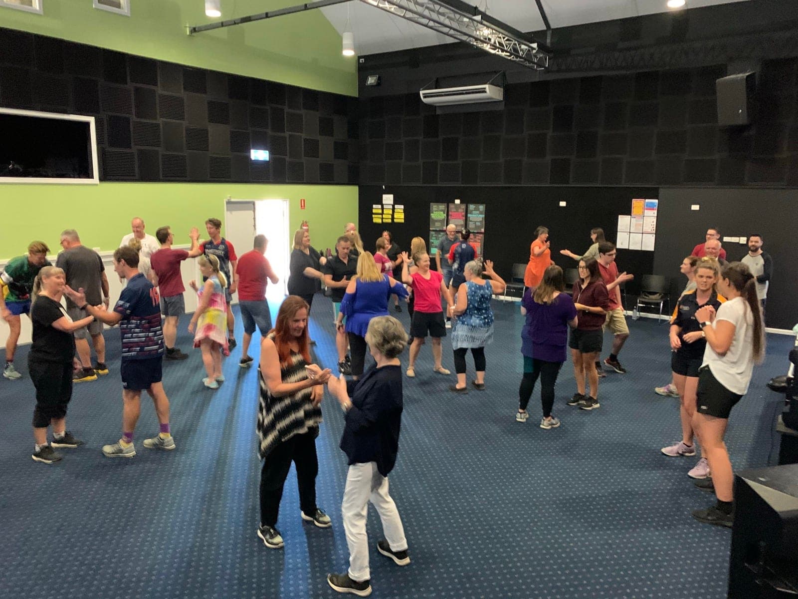 Adults paired up and laughing during a play-based professional learning session